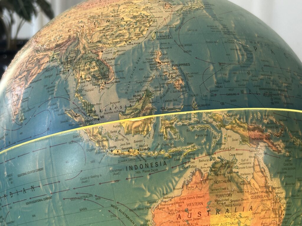 A close up of the globe with the world map in it