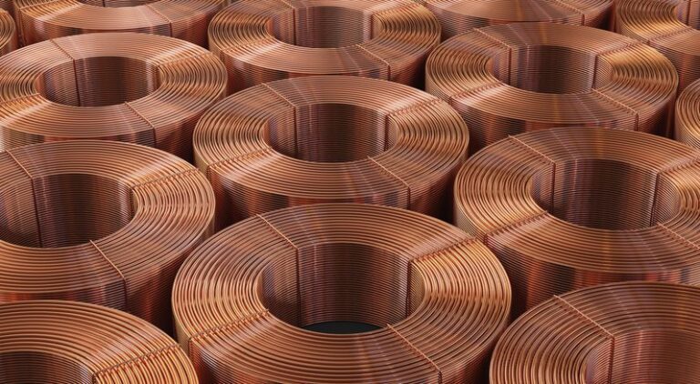 Stacks of copper coils in warehouse.